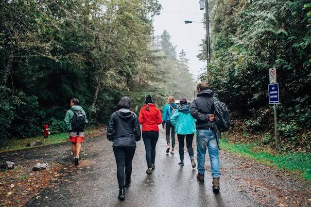 people walking on wet road